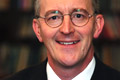 Benn: wants inefficient bulbs phased out by 2011
